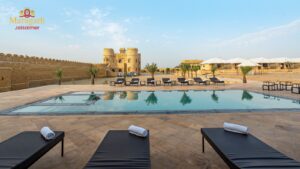 Luxury desert resort pool with tents and fort