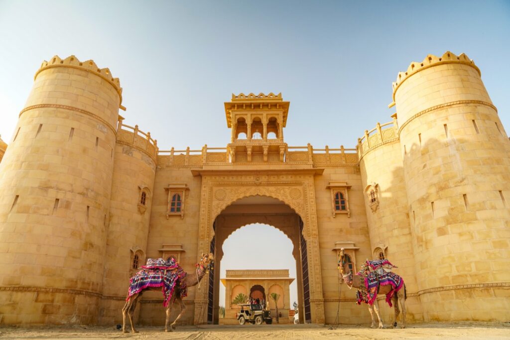 Grand entrance of Marugarh Jaisalmer with camels showcasing royal desert heritage