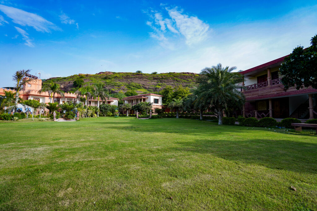Beautiful green lawn with peaceful resort garden views