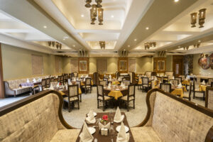 Elegant restaurant seating with warm royal dining ambiance